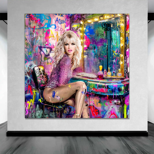 Brigitte Bardot wearing a pink bodysuit, sitting at a vanity table with perfume bottles and makeup, in front of a graffiti-covered wall-art-mockup-Graphique Addictions.