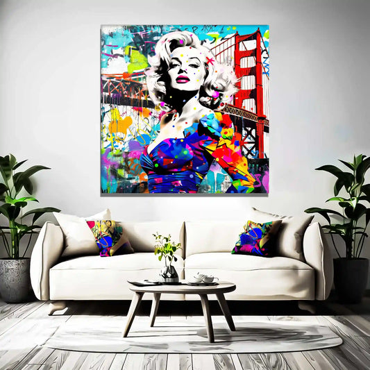 Living room wall art featuring Marilyn Monroe in a colorful blue dress, standing in front of the Golden Gate Bridge, made of colorful graffiti and paint splashes.Titled: Golden Gate Graffiti-Graphique Addictions