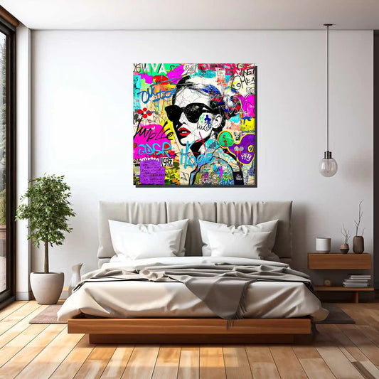 Bedroom display of a woman wearing sunglasses with tattoos on her body and face. Surrounded by street-style stickers, labels, numbers, letters, and symbols in vibrant colors. Titled: Graffiti Chic Chronicles-Graphique Addictions.