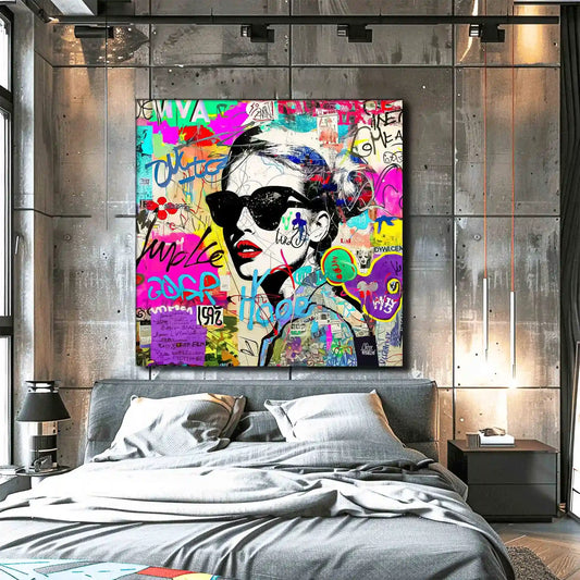 Bedroom wall art of a woman wearing sunglasses with tattoos on her body and face. Surrounded by street-style stickers, labels, numbers, letters, and symbols in vibrant colors. Titled: Graffiti Chic Chronicles-Graphique Addictions.