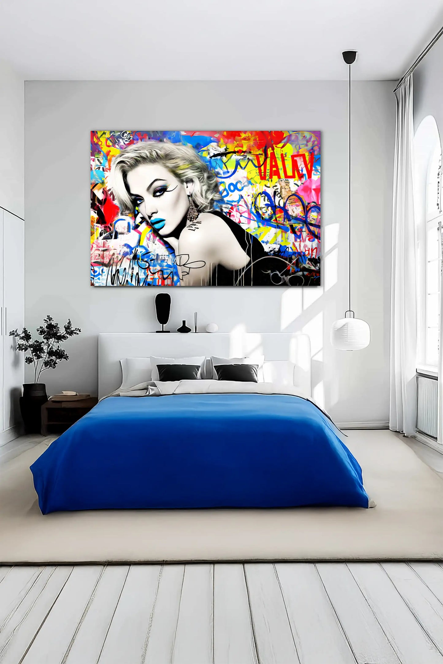 bedroom painting of a woman lying on her stomach, surrounded by vibrant graffiti, wearing blue lipstick and winged eyeliner, in a black dress. Titled: Graffiti Dreamscape-Graphique Addictions.
