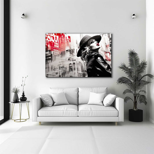 Madonna wearing a black hat, red lipstick, and a leather jacket against a backdrop of New York City buildings living room wall mockup. Madonna in Noir-Graphique Addictions