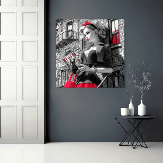 Black and white art of a fashion doll wearing a red skirt and black blazer, on a NYC street corner holding a magazine-NYC-Noir-Doll-hallway-mockup, Graphique Addictions