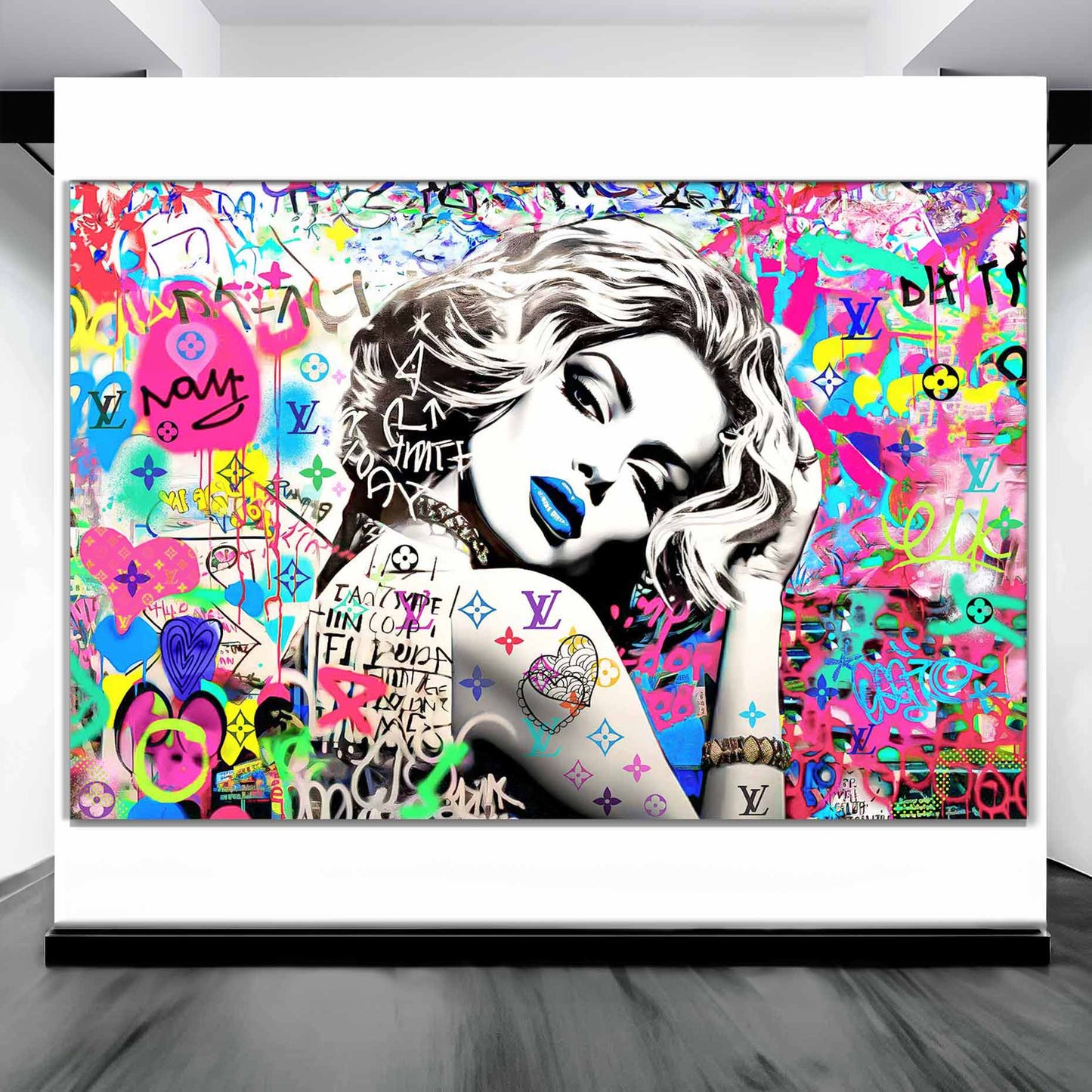 Art display of Madonna wearing blue lipstick surrounded by colorful graffiti and LV monogram tattoo on her arm. Vuitton Tattoo Vixen-Graphique Addictions