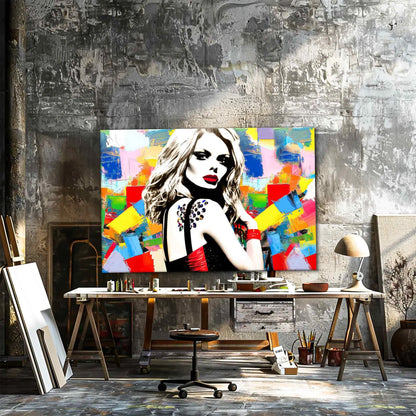 Art Studio mockup of Claudia Schiffer against a backdrop of multi-colored abstract geometric patterns wearing a black and red dress. Claudias Chromatic Cosmos-Graphique Addictions.