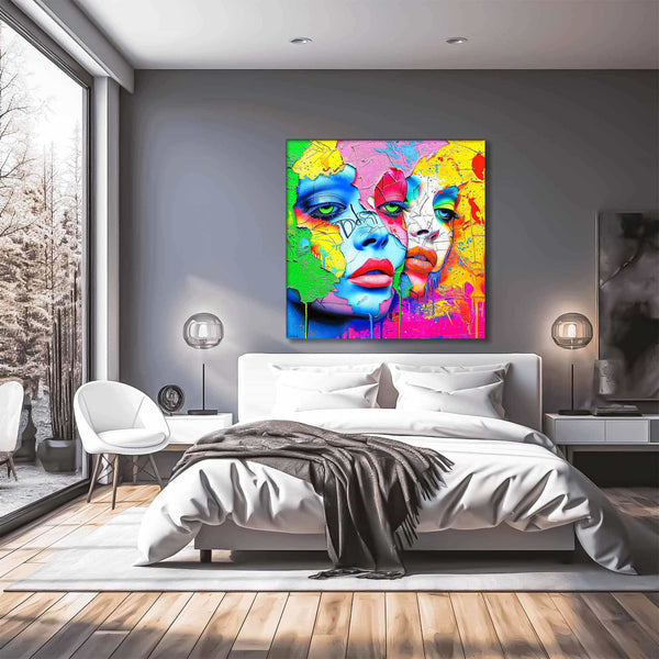 Bedroom wall decor of 2 women's multi-colored porcelain faces that blend into a colorful painted background. Titled: Dual Pop Persona-Graphique Addictions. 