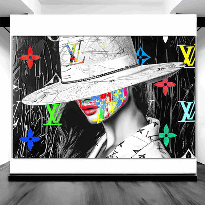 Art gallery display of a woman with colorful graffiti on her face, wearing a wide-brimmed white hat and Louis Vuitton logos in background. Luxury meets graffiti, graphique addictions.