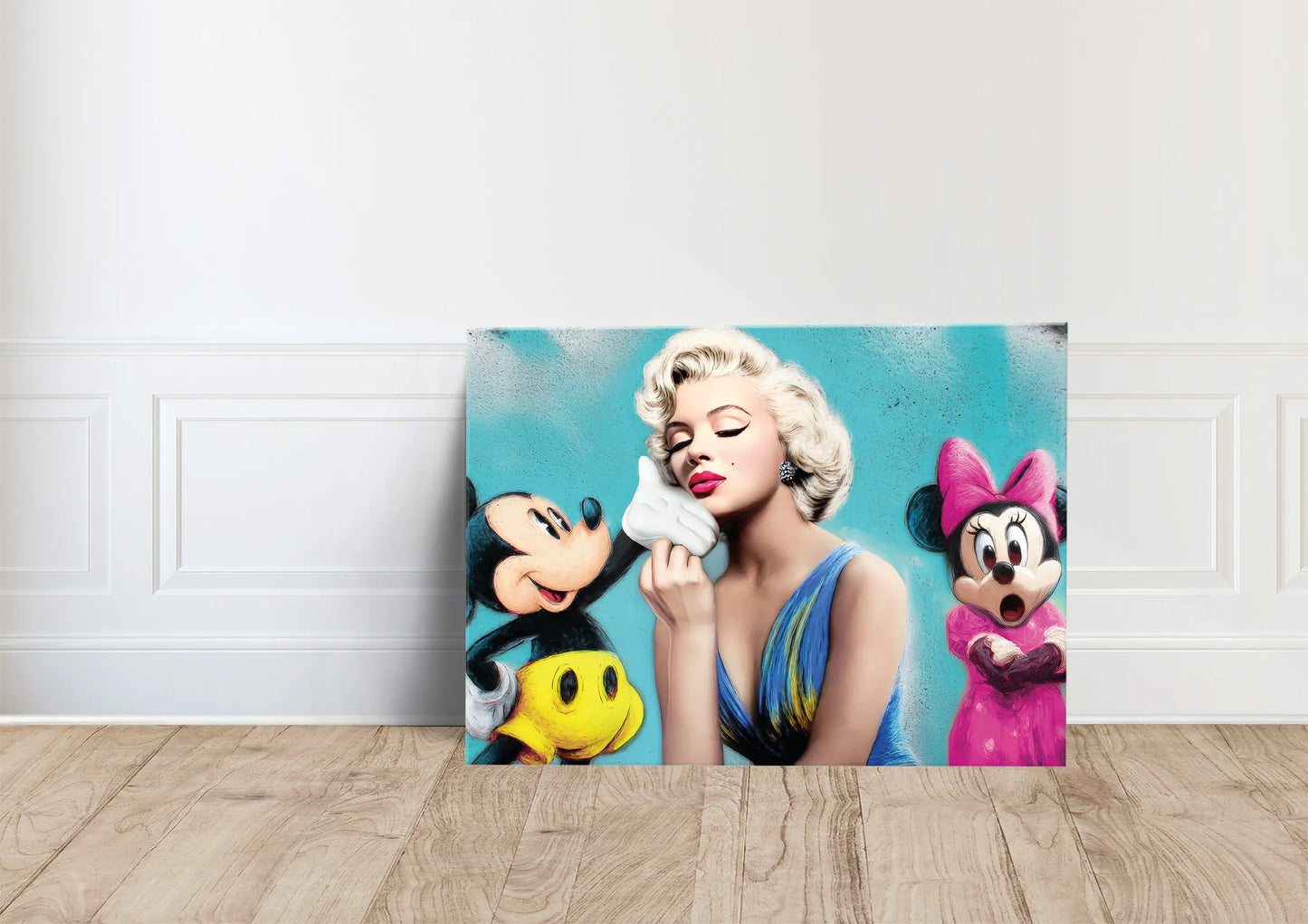 canvas leaning against the wall art mockup of marilyn monroe kissing micky mouse's hand and minnie mouse in the background with her mouth open in shock against a blue background. Graphique Addictions