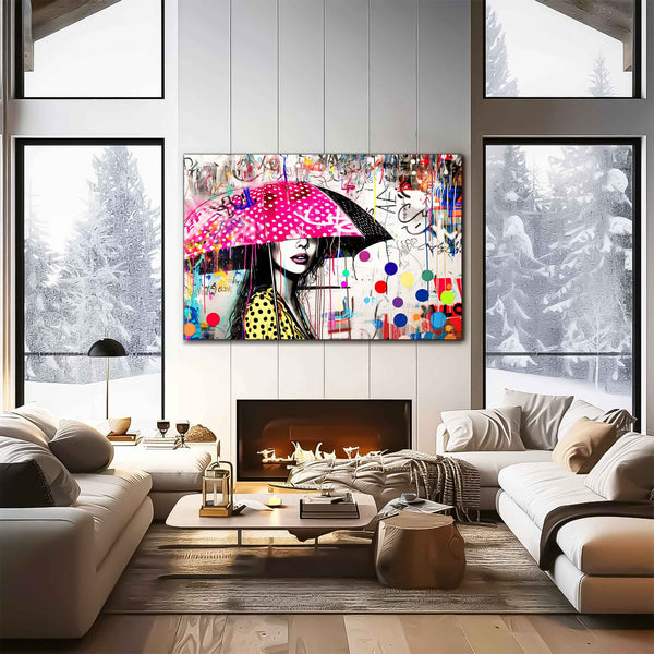Living room wall mockup of woman holding a pink umbrella with white polka dots and colorful paint splashes. Street Art Storm-Graphique Addictions.