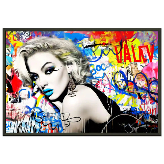 Black metal framed print of woman lying on her stomach, surrounded by vibrant graffiti, wearing blue lipstick and winged eyeliner, in a black dress. Titled: Graffiti Dreamscape-Graphique Addictions.