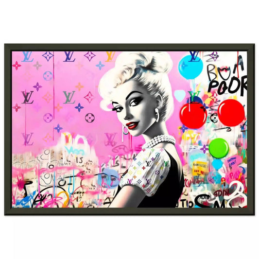 Black metal framed print of a barbie inspired doll wearing a black dress with white ruffles against a bubblegum pink backdrop of colorful LV monograms and graffiti and balloons. Luxe Pink Vuitton-Graphique Addictions.