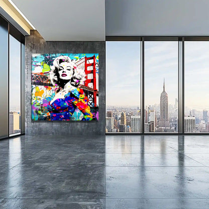 Loft office wall art featuring Marilyn Monroe in a colorful blue dress, standing in front of the Golden Gate Bridge, made of colorful graffiti and paint splashes.Titled: Golden Gate Graffiti-Graphique Addictions