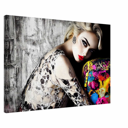 Canvas print of blonde model with bold red lips, wearing a black-and-white lace dress, leaning against a colorful sofa with a textured black-and-white wall in the background. Red Lips and Lace-Graphique Addictions.